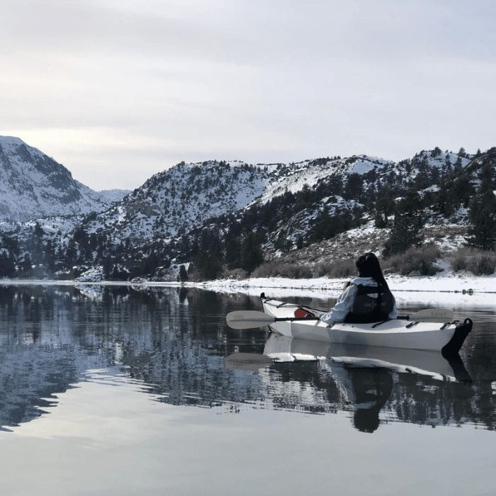 best folding kayaks in 2024 oru kayak bay st being paddled in snowy conditions