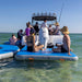 Boat parties made even better by the AquaDeck Inflatable U Shaped Pontoon for Outboard Boats