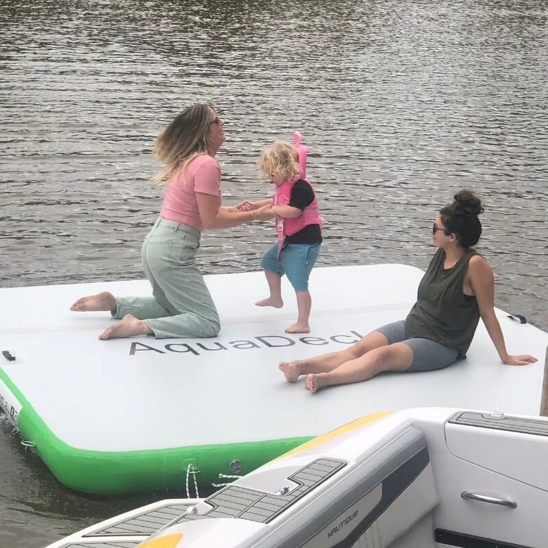 Aquadeck Inflatable Dock with family playing and relaxing on floating dock