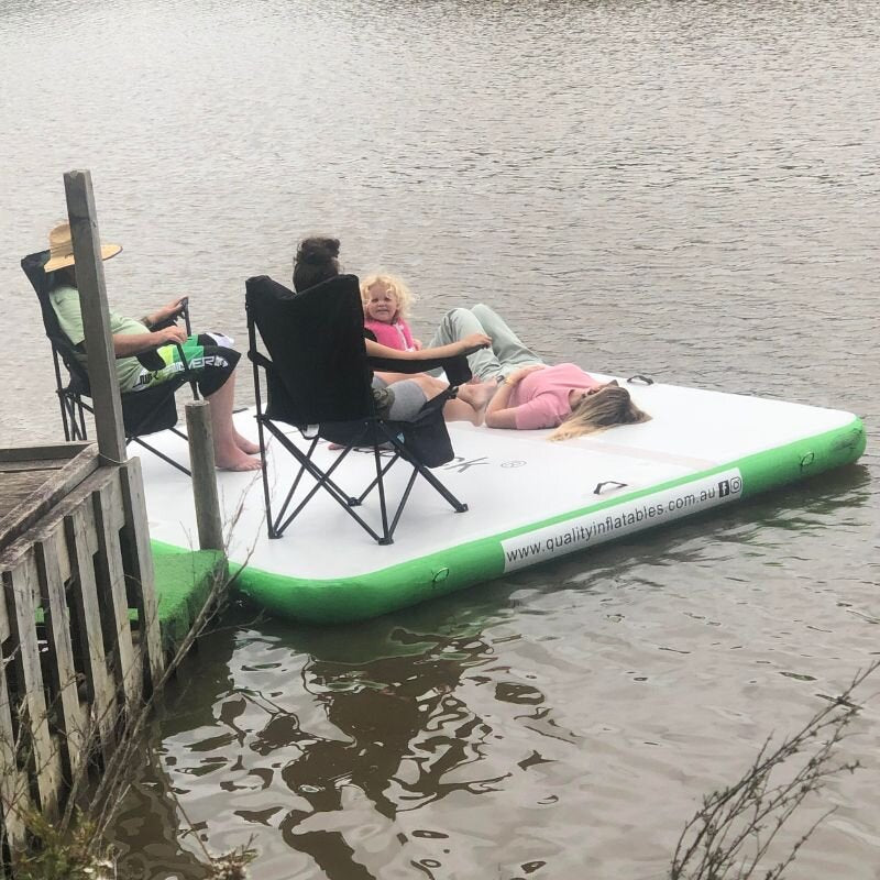 Aquadeck Inflatable Lounge floating dock with family relaxing on water