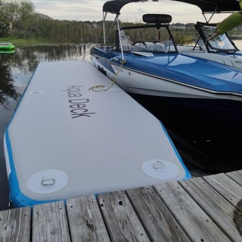 Aquadeck Inflatable Straight Pontoon in use with a boat, showcasing stability