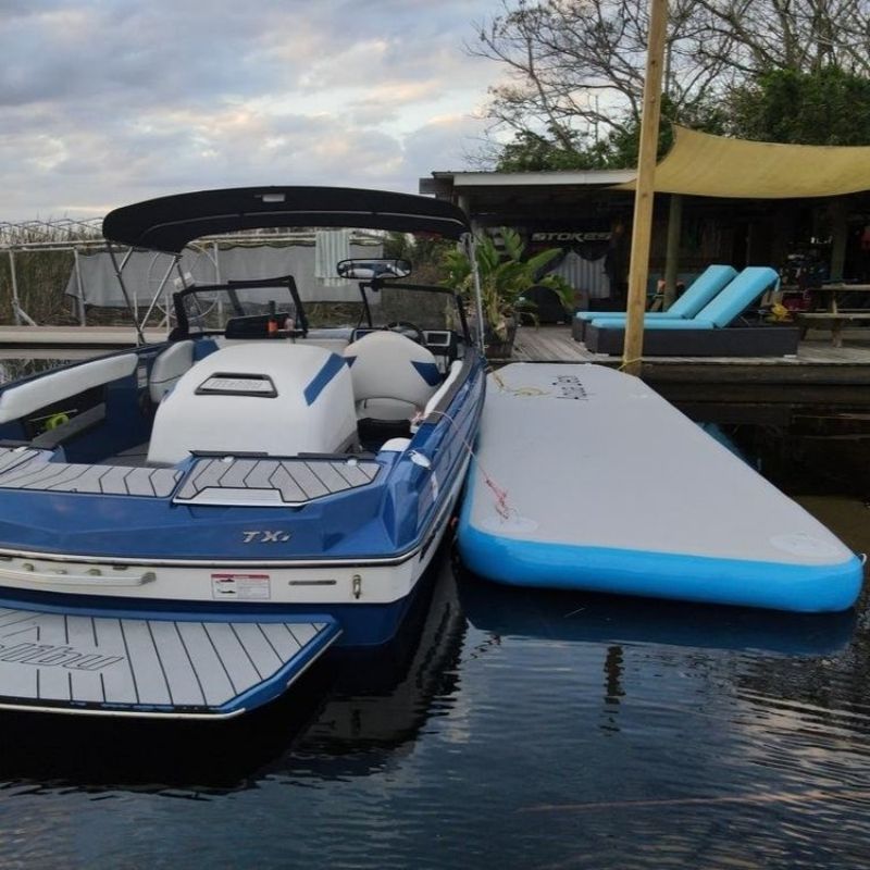 Overhead view of Aquadeck Inflatable Straight Pontoon next to a boat