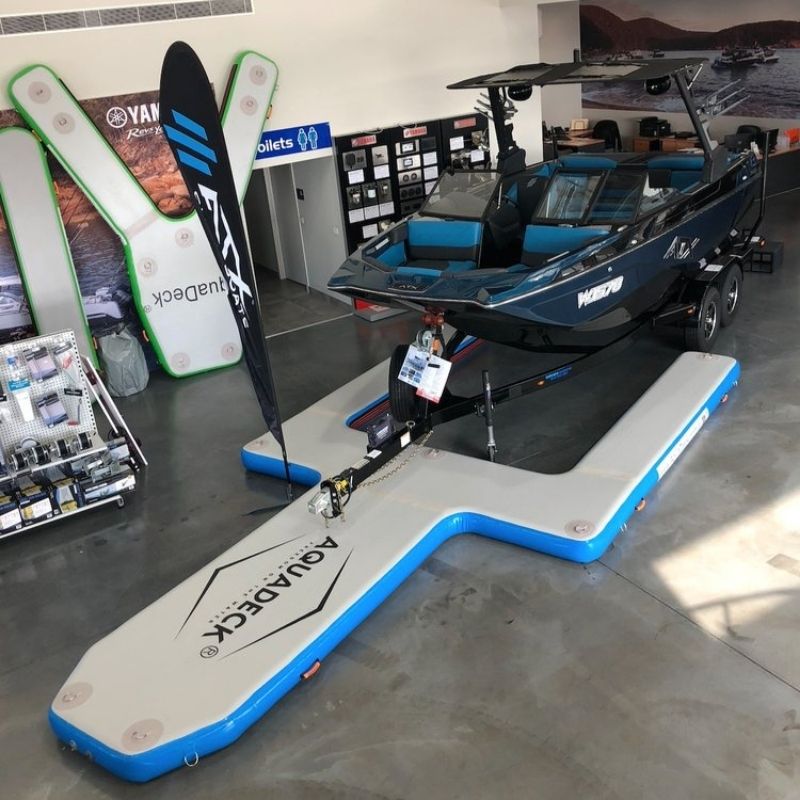 Aquadeck Inflatable U Pontoon displayed in store with boat