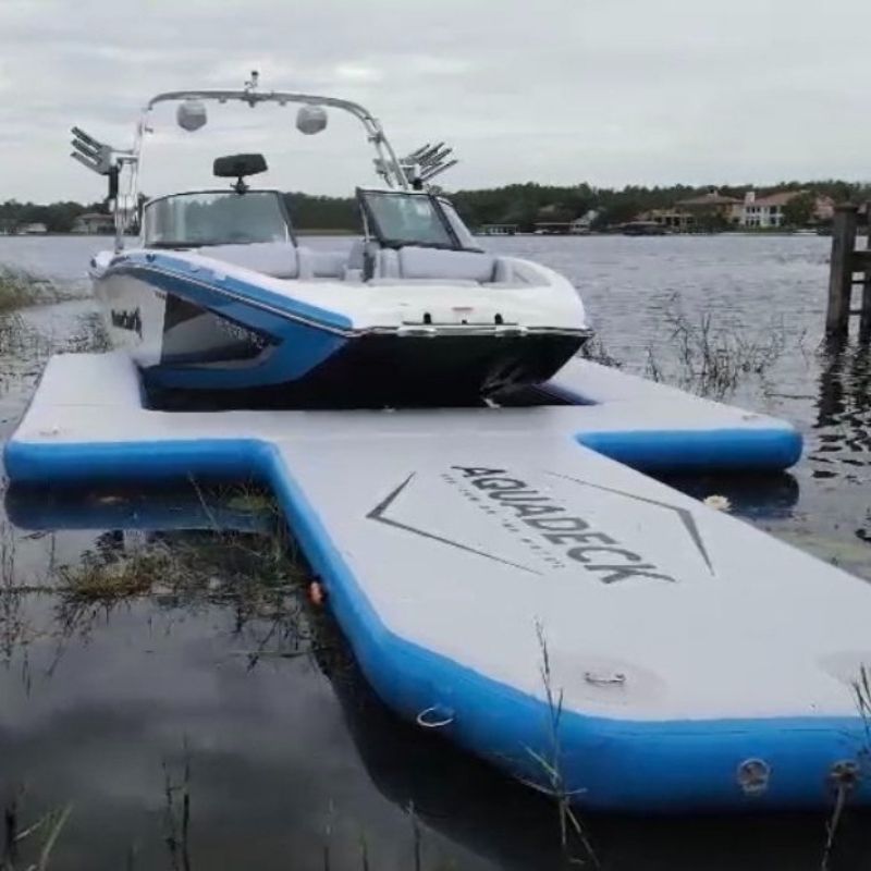 Aquadeck Inflatable U Pontoon docked boat from side angle