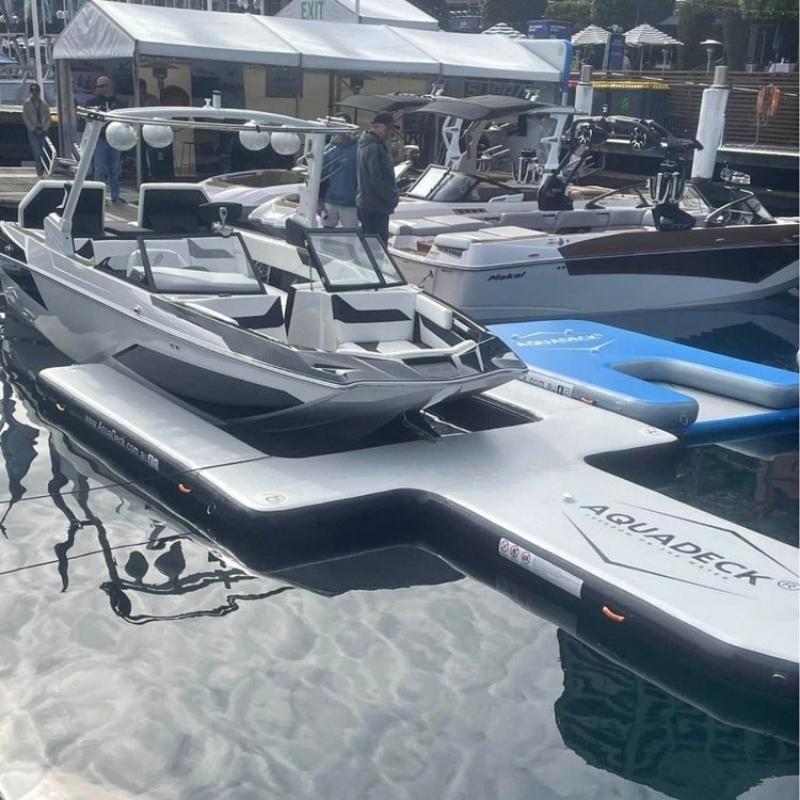 Aquadeck Inflatable U Pontoon docked with boat water view