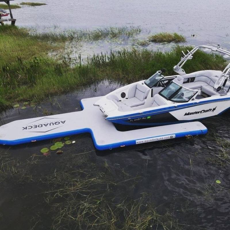 Aquadeck Inflatable U Pontoon moored boat in calm water