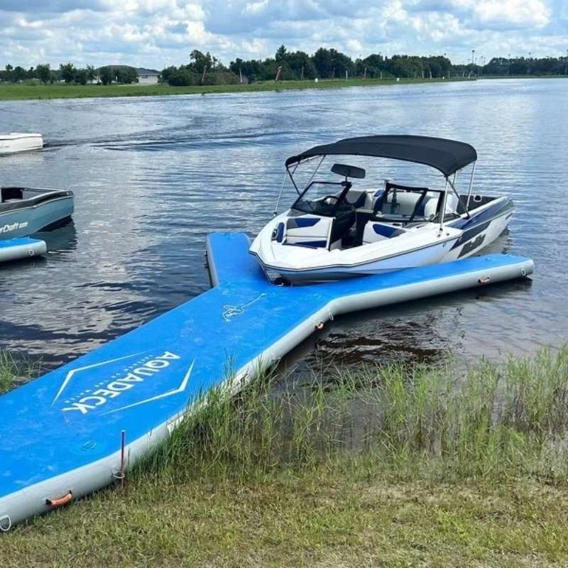 Aquadeck Inflatable Y Pontoon with a blue design near the shore