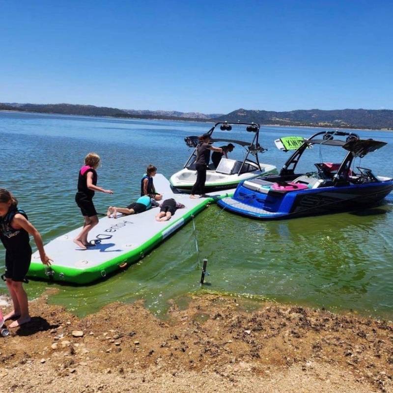 Aquadeck Inflatable Y Pontoon with children playing near boats