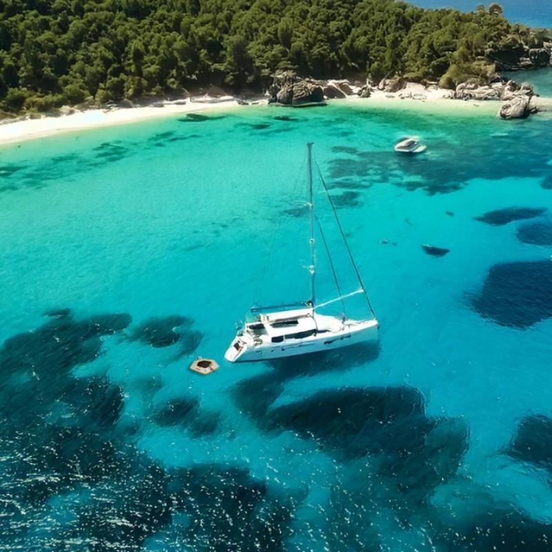 Bartlett 3.5m Hex Deck Water Hammock in turquoise waters near a yacht