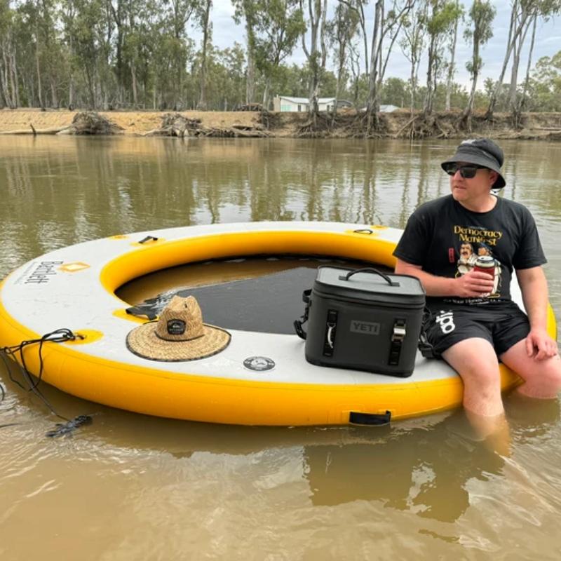 Family enjoying time on the Bartlett 3m Circle Hammock floating on a river