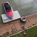 Bartlett 4m X 2m V Deck inflatable pontoon used as a dock with speedboat and inflatable tube nearby