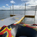 Bartlett 4m X 2m V Deck inflatable pontoon floating on a lake with inflatable tube in the foreground