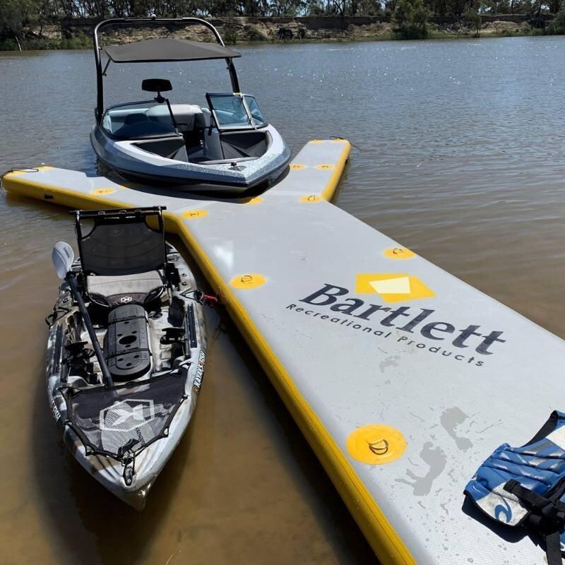 Bartlett 8m X 5m Y-shaped inflatable pontoon setup with boat and kayak for water activities