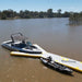 Bartlett 8m X 5m Y-shaped inflatable pontoon docked with a kayak and boat on the lake