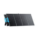 Bluetti PV120 portable solar panel powering a camping tent