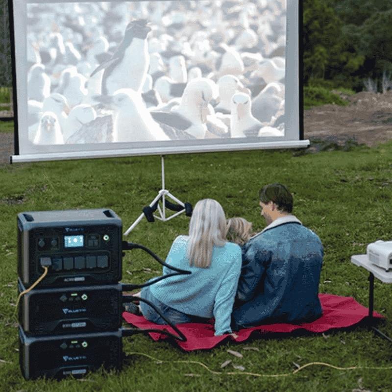 Bluetti PV200 solar panel powering an outdoor movie setup