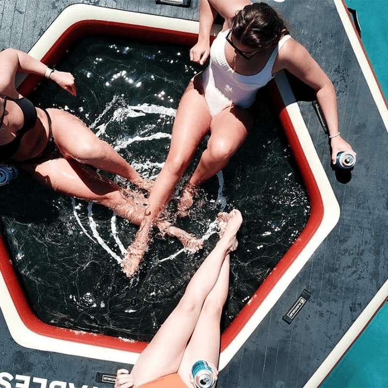 Floatables inflatable water hammock pontoon dock enjoyed during a beach party