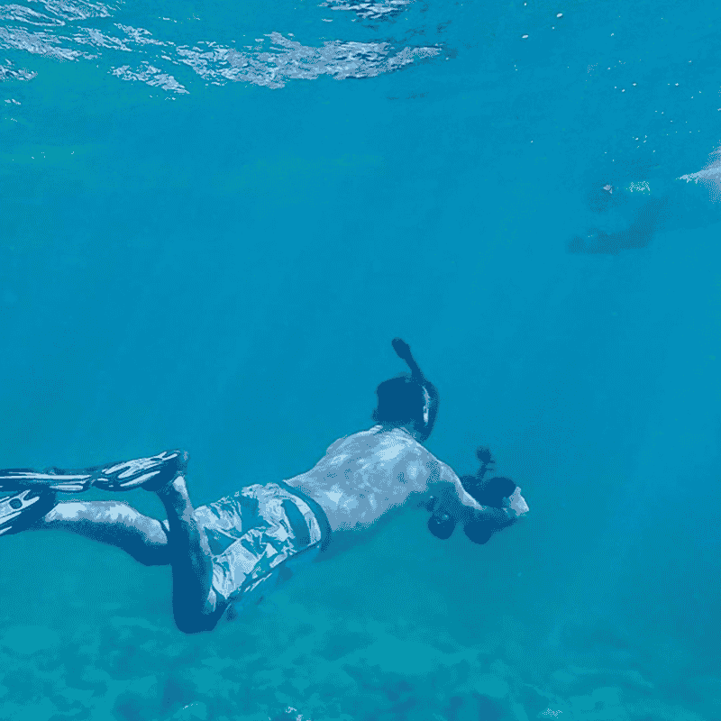 Snorkeler using LEFEET S1 Pro dual underwater scooter while swimming