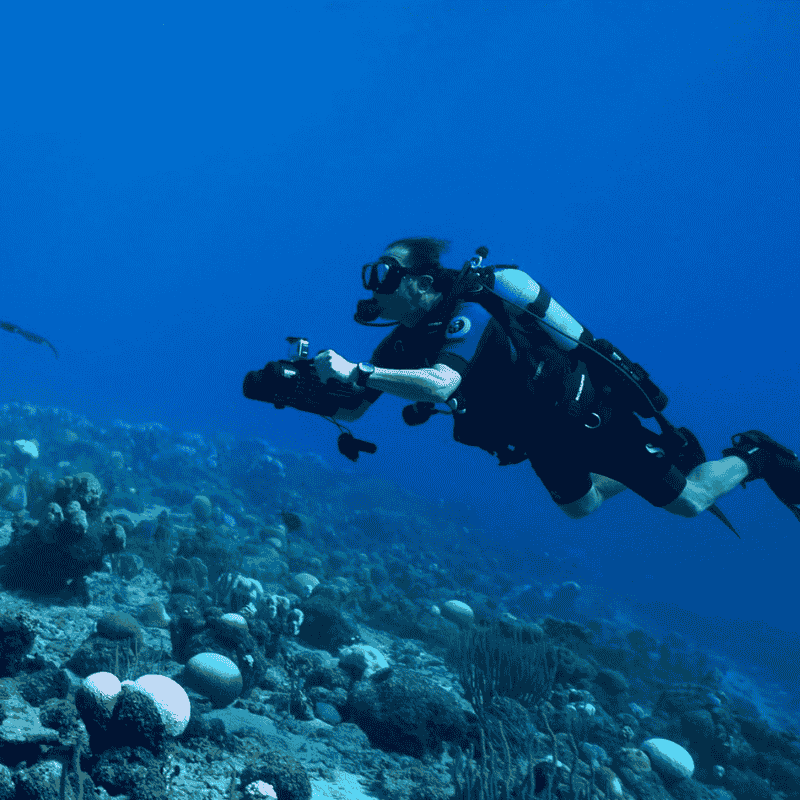 Diver using LEFEET S1 Pro dual underwater scooter exploring coral reef