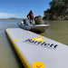 Man standing next to boat and Bartlett Straight Inflatable Pontoon on the water