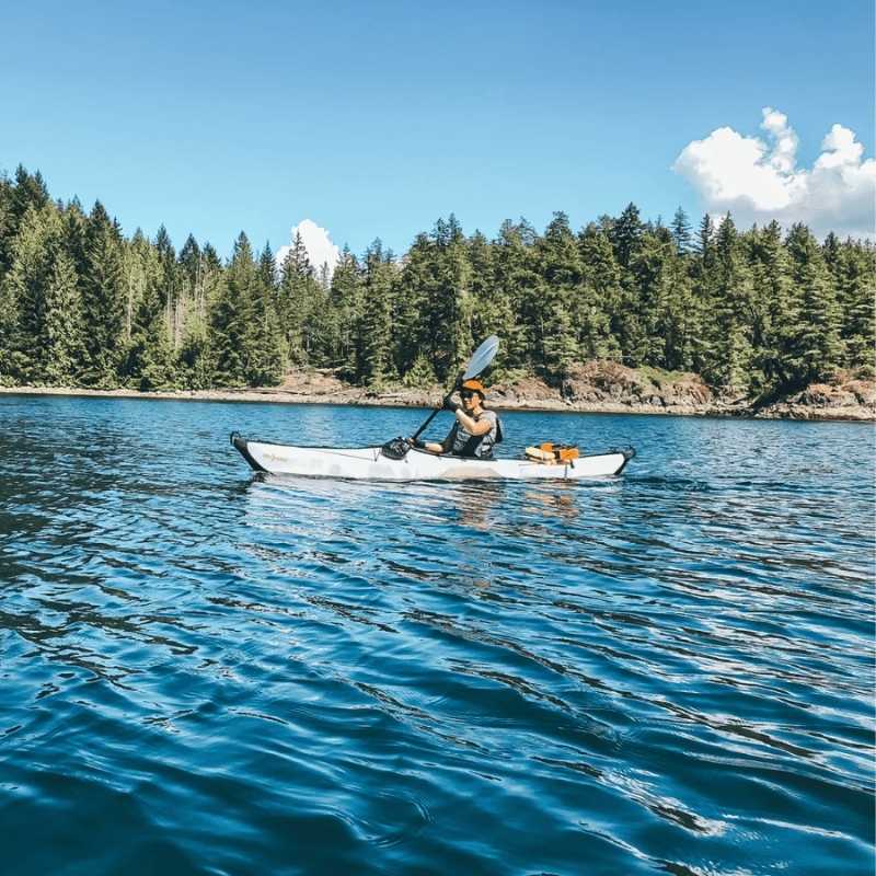 Oru Bay St Kayak paddling on calm blue water lake