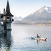 Oru Beach LT kayak paddling in a mountain lake with scenic views