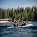 Oru Kayak Haven TT tandem kayak paddling in serene lake surrounded by trees