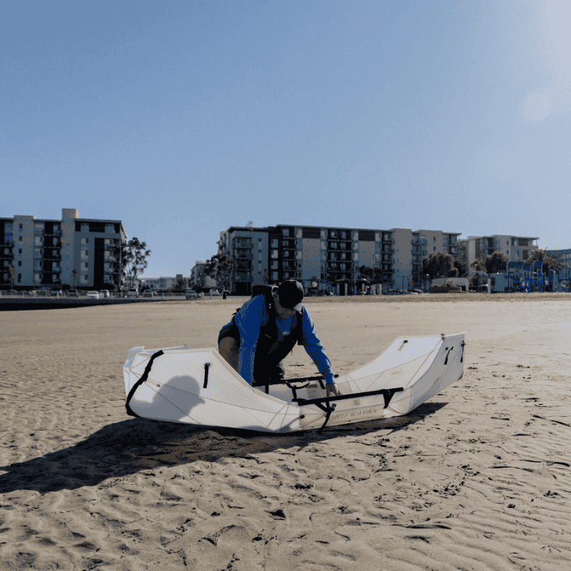 Oru Lake+ folding kayak setup on a sandy beach