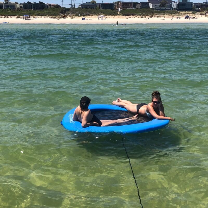 Relax under the sun with your significant other with the AquaDeck Small Inflatable Sea Pool