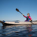 Woman paddling the Sea Eagle 393 RazorLite kayak on a calm lake