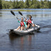 Sea Eagle 437ps inflatable kayak paddling on a lake with two paddlers