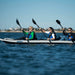 Three paddlers kayaking on a lake using the Sea Eagle 465ft FastTrack kayak