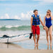 Couple walking with the Terravent K1 Folding Kayak after a beach adventure