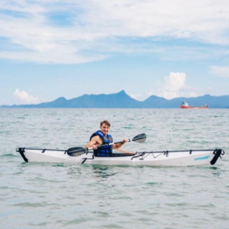 Man paddling Terravent K1 Folding Kayak on open water during an adventure