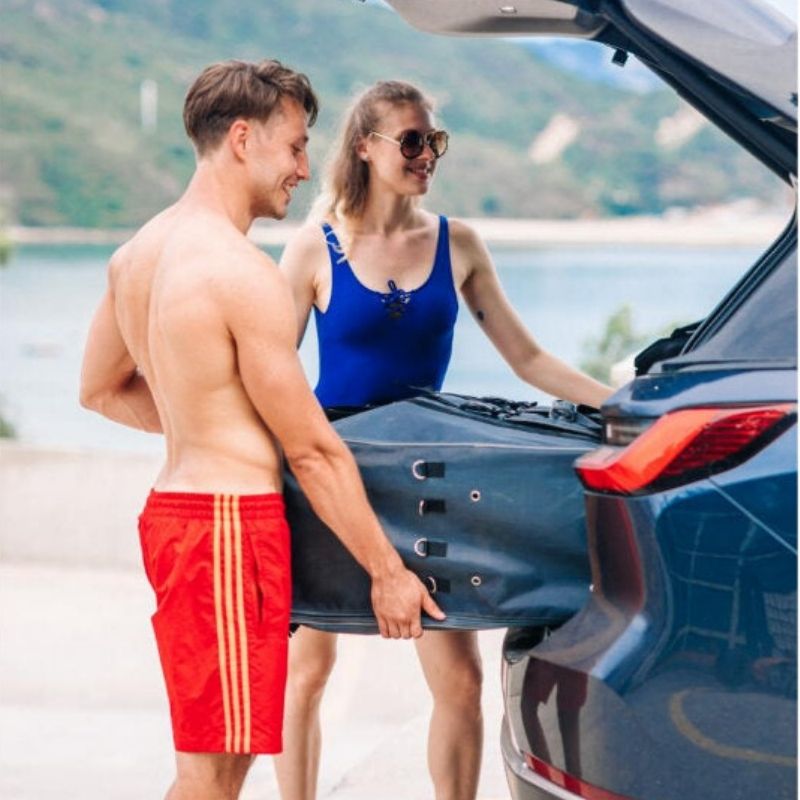 Couple loading Terravent K1 Folding Kayak into vehicle for easy storage