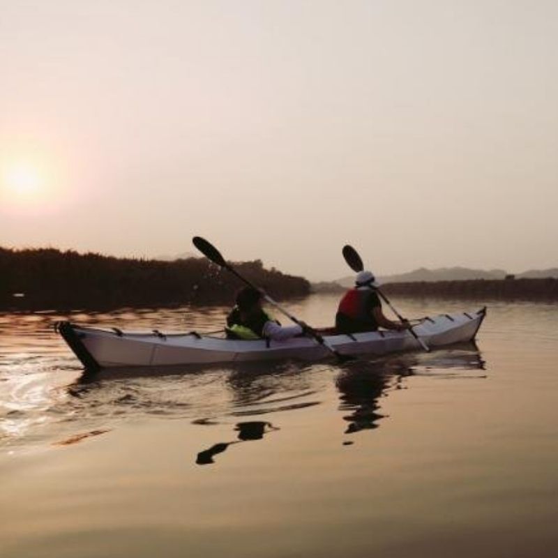 Terravent K3 Folding Kayak paddling at sunset on calm water