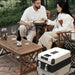 Couple enjoying outdoor romantic setting with Urecau Outdoors FCRS45 45L Portable Fridge-Freezer with Table